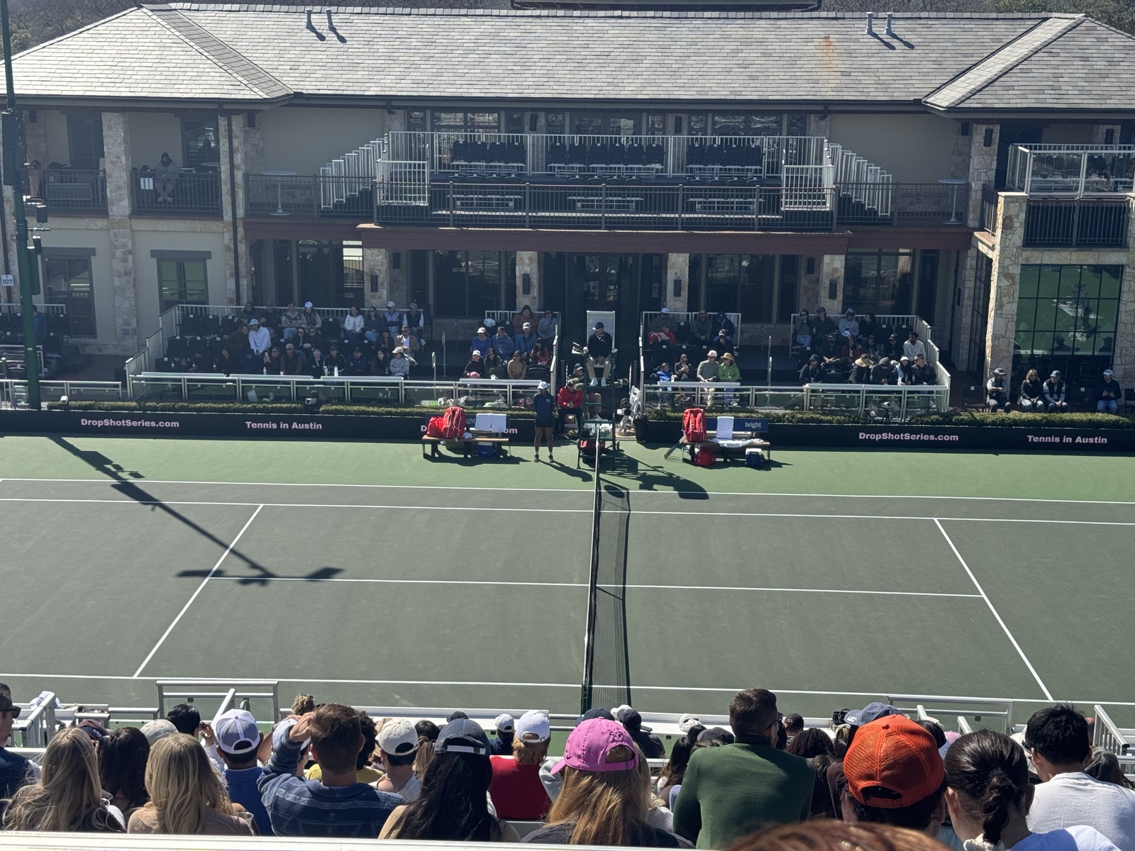 Watching a match from the stands at a tennis tournament in Austin