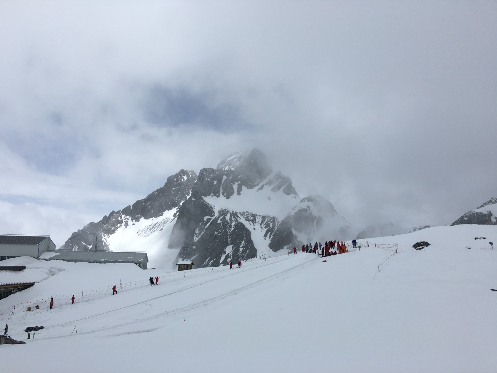 A snow-covered peak above a glacier park