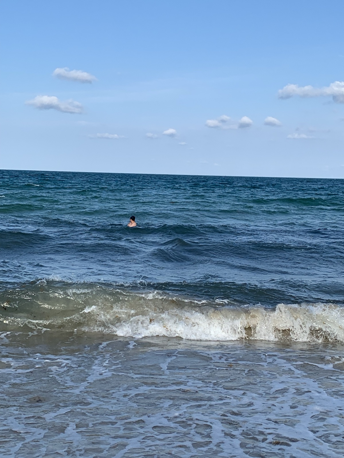 Swimming out past the breaking waves